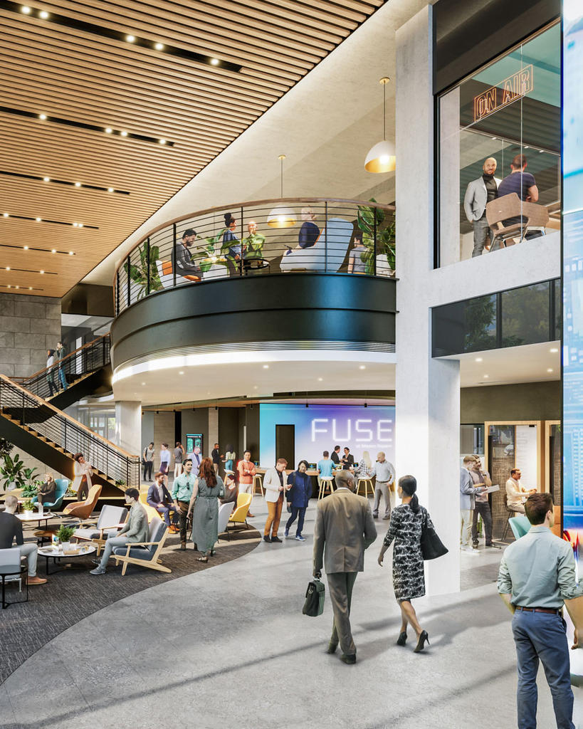 A computer rendering of the interior lobby of the future FUSE building, occupied by people.