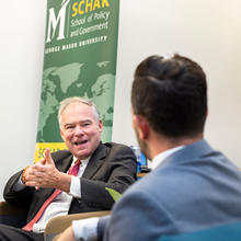 U.S. Senator Tim Kaine (D. Va.) converses with moderator Justin Gest at the semester's first Master's in Public Policy Bistro at the Schar School of Policy and Government at George Mason University