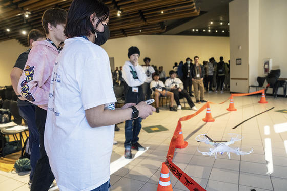 students work with CyberSlam 2023 drone